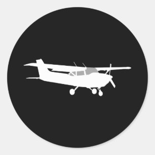Adesivo Redondo Silhueta de Cessna clássica voando em preto