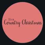 Adesivo Redondo Tipografia Vermelha do Country Christmas<br><div class="desc">Vinheta Clássica De Tipografia Vermelha De Natal Do País. Fundo vermelho. Citação: A preto estão as palavras "É um Natal do País" em dois tipos de tipografia.</div>