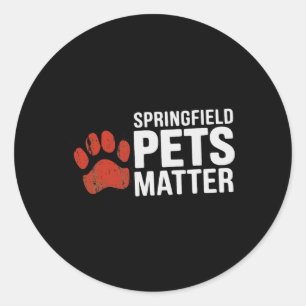 Adesivo Redondo Trump Eles Estão Comendo Cães Gatos Springfield Pe
