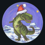 Adesivo Redondo Tyrannosaurus Christmas<br><div class="desc">O design de Natal Tyrannosaurus Rex da Parada Animal apresenta nosso lindo Tyrannosaurus Rex vestindo um chapéu vermelho de Papai Noel e colocando-se em uma paisagem nevada contra um céu noturno azul estrelado. Nossa arte original de dinossauro foi pintada pelo ilustrador de nossas crianças talentosas Traci Van Wagoner. Em muitos...</div>