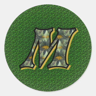 Adesivo Redondo Vinheta inicial de margaridas pretas M monograma