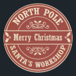 Adesivo Redondo Vintage red Felry Christmas North Poli sticker<br><div class="desc">Um adesivo do estilo postal de Natal para presentes. O design diz "Polo Norte" e "Workshop de Papais noeis" à volta da fronteira, a vermelho e branco, e diz "Feliz Natal" à frente, com padrões sagrados e sujos ao fundo. O autocolante foi concebido para se parecer com um carimbo postal...</div>