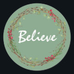 Adesivo Redondo Winter Greenery Berries Wreath Christmas Acredita<br><div class="desc">Vedante de envelope festivo elegante e moderno ou adesivo de presente para o Natal com o texto "Acredite" na caligrafia branca em um fundo verde e um toque de na moda do verde de inverno e da coroa de frutas. Desenvolvido exclusivamente para você pelo Happy Dolphin Studio. Se precisar de...</div>