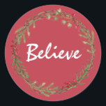 Adesivo Redondo Winter Greenery Berries Wreath Christmas Acredita<br><div class="desc">Vedante de envelope festivo elegante e moderno ou adesivo de presente para o Natal com o texto "Acredite" na caligrafia branca em um fundo vermelho e um toque de na moda do verde de inverno e da coroa de frutas. Desenvolvido exclusivamente para você pelo Happy Dolphin Studio. Se precisar de...</div>