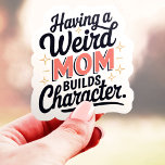 Adesivo Ter Uma Mãe Estranha Constrói Caráter Funny Vinyl<br><div class="desc">Este adesivo engraçado e identificável é perfeito para qualquer pessoa que tenha uma mãe excêntrica ou não convencional! Com a frase "Ter uma mãe estranha constrói caráter", este design é uma homenagem leve às mães que abraçam suas personalidades únicas. Feito com vinil durável, este adesivo é ótimo para laptops, garrafas...</div>