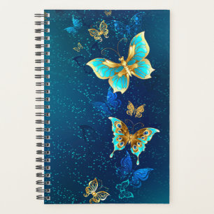 Agenda Borboletas de ouro em um fundo azul