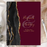Agenda Casamento Dourado de Borgonha Preta com Script Geo<br><div class="desc">Este elegante planejador de casamento moderno apresenta uma design de aquarela preta, aparada com falsa brilho dourado. Personalize facilmente o texto dourado em fundo burgundy, com os nomes da noiva e do noivo em caligrafia manuscrita sobre um grande e grande painel. Adicione o título e a data do casamento em...</div>