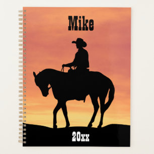 Agenda Cowboy em Horseback no Sunset