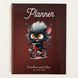 Agenda Gato Preto Repleto na Bicicleta Vermelha