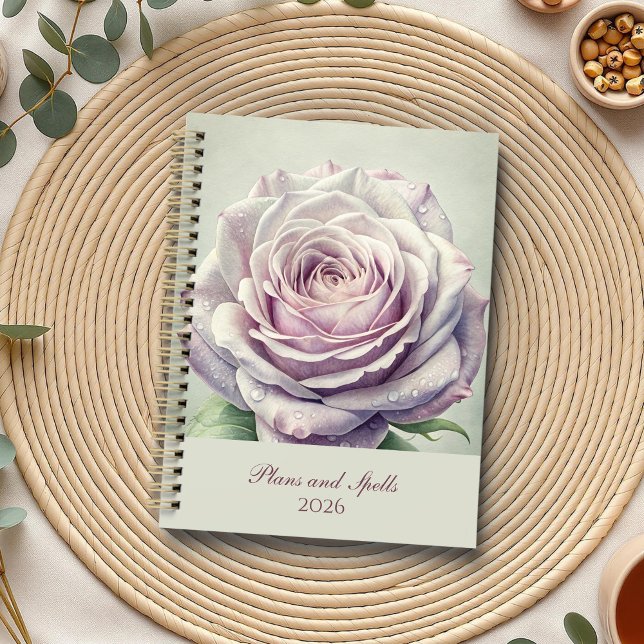 Agenda Rosa de lua entonada (Enchanted Moonlit Rose Planner on a boho table with botanicals and a cup of tea.)