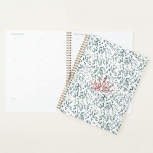 Agenda uma flor vermelha sobre fundo preto