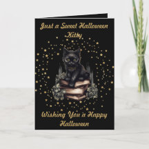 Gatinho de Halloween com Cartão de Estrelas e Livr