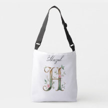Bolsa transversal com letra H floral em dourado el
