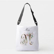 Bolsa transversal com letra M floral em ouro elega