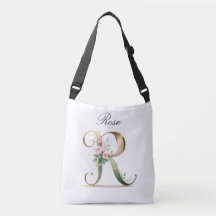 Bolsa transversal com letra R floral em dourado el