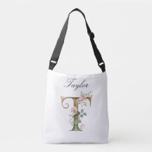 Bolsa transversal com letra T floral em dourado el