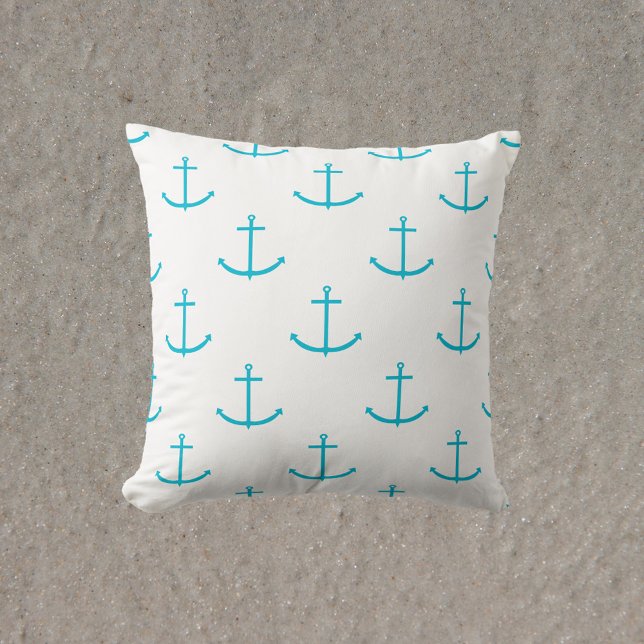 Almofada Anchor Turquoise Patterno (A throw pillow with a pattern of turquoise anchors)