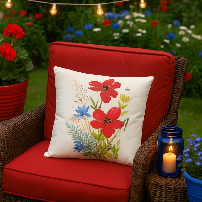 Almofada Aquarela Flores Vermelhas e Azuis em um Branco (festive summer patio mockup featuring the red poppy pillow and it’s bursting with charm.)
