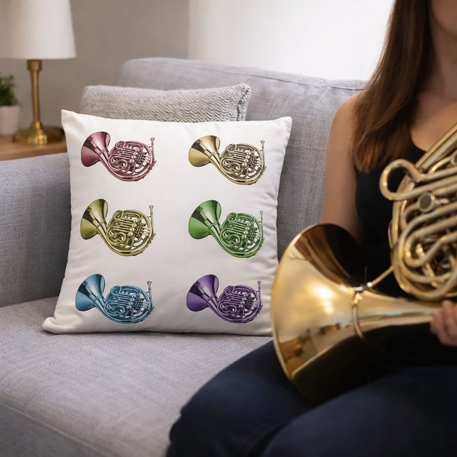 Almofada Arte Pop Colorida de Trompa Francesa  (A throw pillow with a rainbow pattern of french horns.)