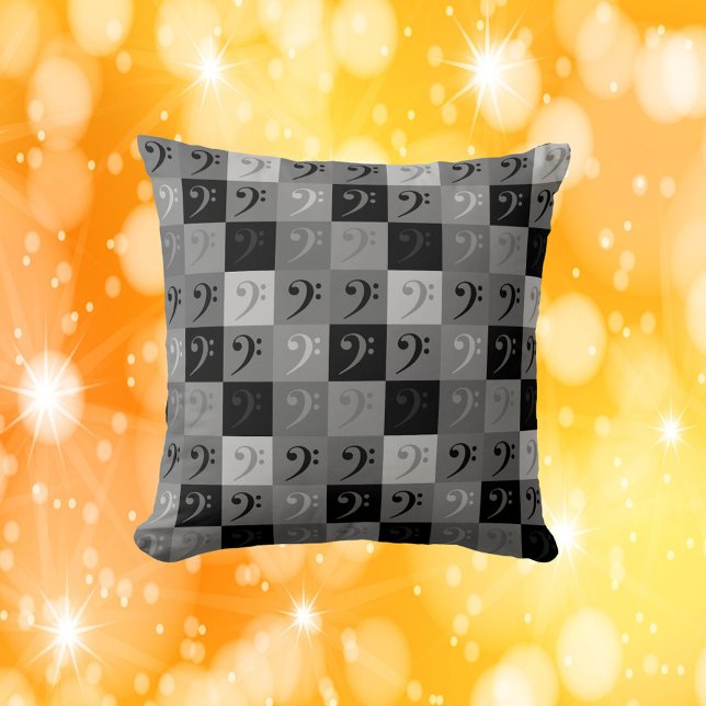 Almofada Bass Clef Black and Cinza (A throw pillow with a bass clef pattern in blacks and grays)