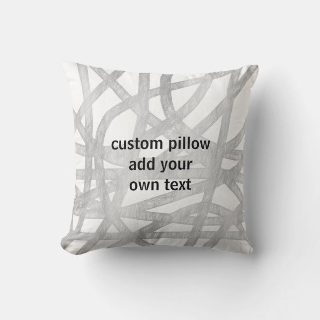 Almofada cinza e design pintado branco adicione o texto da  (Frente)