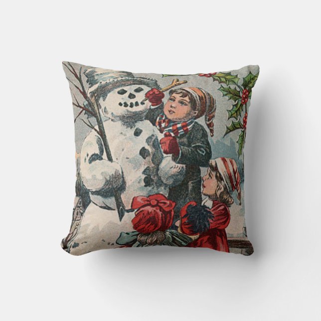 Almofada Crianças Fazendo Boneco de Neve com Azevinho (Frente)