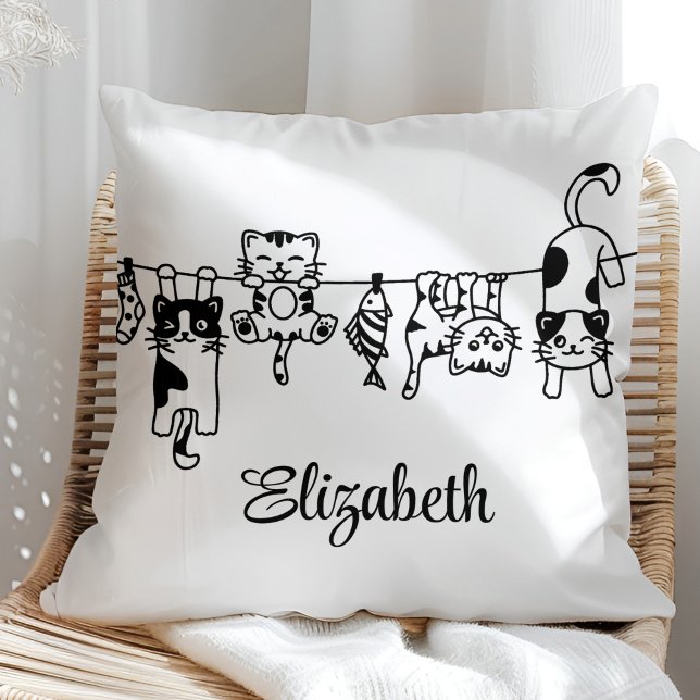 Almofada Cute Hanging Kittens Custom Name (Cute Hanging Kittens Custom Name Throw Pillow in a sunny boho neutral rattan chair.)