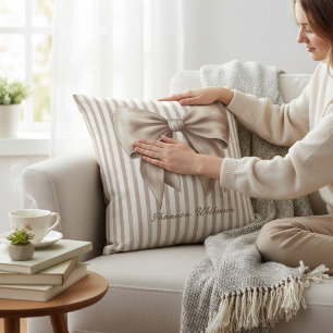 Almofada de lançamento com design listrado e laço