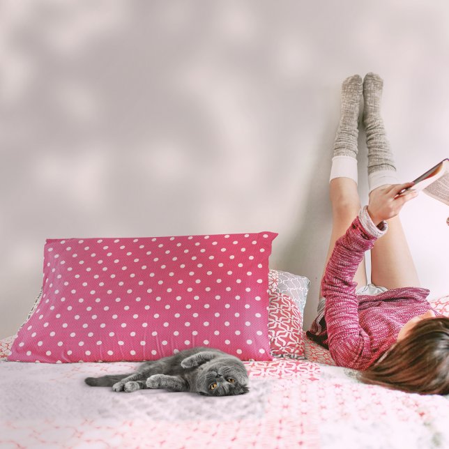 Almofada Decorativa Vermelho Dotty Delight (A girl is beside a Dotty Delight Red Accent Pillow on the bed.)