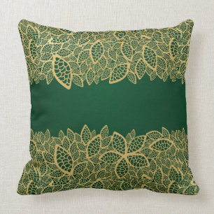 Almofada Laço dourado da folha no fundo verde