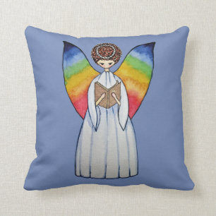 Almofada O anjo da aguarela com arco-íris voa lendo um