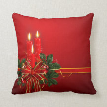 O vermelho Candles a fita e o azevinho