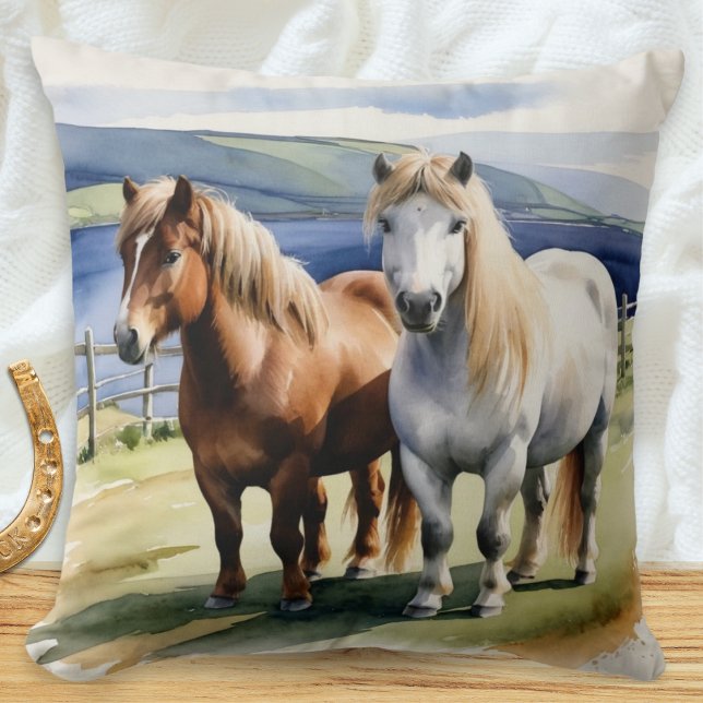 Almofada Pône Shetland Ilustrado em Aquarela (A throw pillow with illustration of two Shetland ponies in a field in a watercolor style)