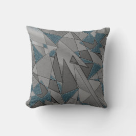 Almofada recortes triangulares das cinzas sobre fundo azul,