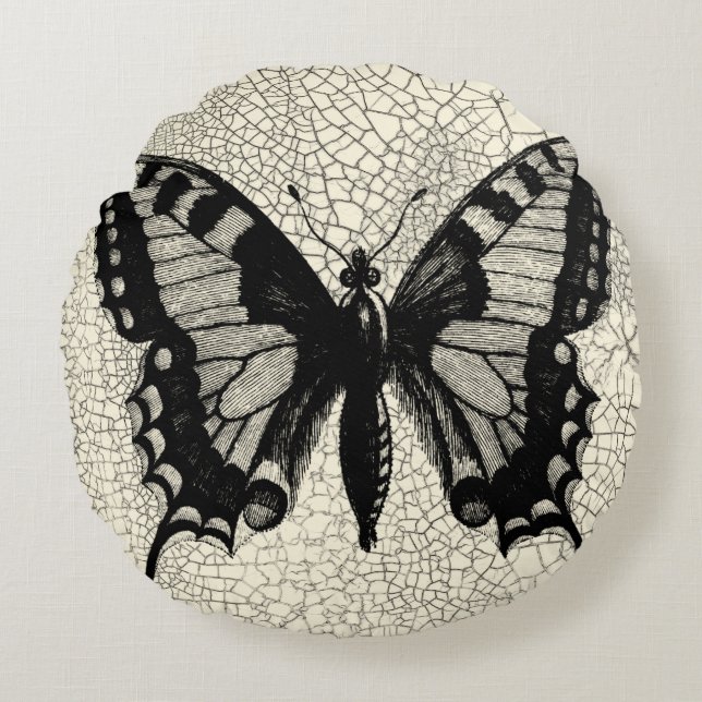Almofada Redonda Borboleta Preta e Branca sobre fundo rachado (Frente)
