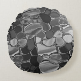 Almofada Redonda Cinzas claras e formas arredondadas escuras.