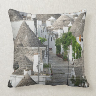 Almofada Rua com as casas do trulli em Alberobello, Puglia