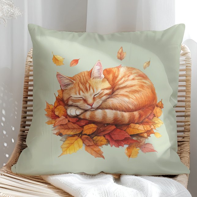 Almofada Travesseiro Verde Ginger Ginger Sage (Cozy Sleeping Ginger Cat Terracotta Pillow in a sunny boho rattan chair.)