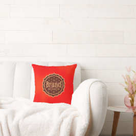 Almofada vermelha com um logotipo decorativo