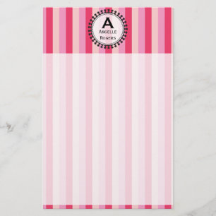 Artigos de papelaria cor-de-rosa dos toldos