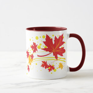 As folhas de bordo na queda colorem a caneca feita