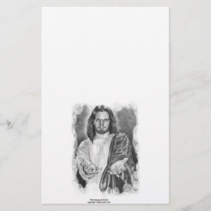 As mãos de artigos de papelaria do cristo