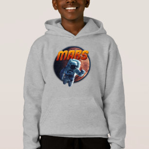 Astronauta em frente ao planeta Marte.