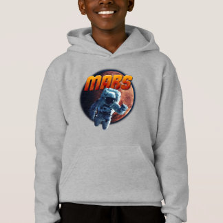 Astronauta em frente ao planeta Marte.