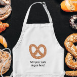 Avental Personalizar este gráfico do nó Pretzel<br><div class="desc">Adicione um slogan ou nome para criar um presente personalizado com um tema de pretzel. Imagem mostra um nó de pretzel em estilo alemão do pão (ou poderia ser um salgadinho de pretzel amarrado) estudado com cristais de sal.</div>