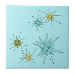 Azulejo atômico azul de Starbursts do ovo do pisco<br><div class="desc">O teste padrão atômico icónico azul do azulejo de Starbursts do ovo deste pisco de peito vermelho caracteriza starbursts atômicos icónicos. Isso é direito! A velha escola, fundo colorido azul do ovo do pisco de peito vermelho com salpicos do ouro é o contexto perfeito para a turquesa vibrante, o aipo...</div>