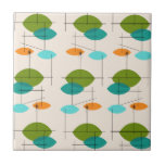 Azulejo de Cerâmica de Padrão Atômico<br><div class="desc">Este Azulejo de Cerâmica com Padrão Tropical Móvel Atômica é o meio século moderno no seu melhor. A design inspirada na safra apresenta um fundo creme com ovais coloridos pontiagudos em verde-turquesa, laranja, lacrimejo e abacate. Os ovais verdes de chá e abacate se sobrepõem criando uma bela sombra de azul-pavão....</div>