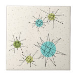 Azulejo pequeno atômico icónico de Starbursts<br><div class="desc">Este teste padrão pequeno atômico icónico do azulejo de Starbursts caracteriza starbursts atômicos icónicos. Isso é direito! A velha escola, o fundo colorido de creme com salpicos do ouro é o contexto perfeito para a turquesa vibrante, o aipo reconfortante, e os círculos coloridos do verde kitschy da pera. Os pontos...</div>