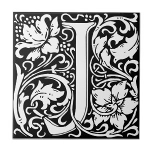 Azulejo preto e branco art nouveau com a letra J