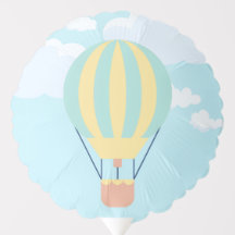 Balão de ar quente verde e amarelo no céu